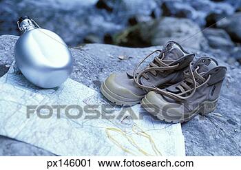 Stock Photography - still life of 
hiking boots, 
canteen and map. 
fotosearch - search 
stock photos, 
pictures, images, 
and photo clipart