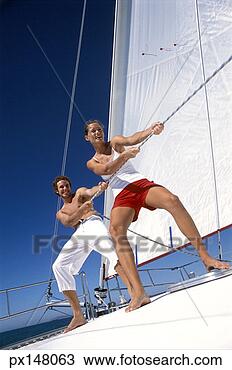 Stock Photo - portrait of a 
young couple sailing. 
fotosearch - search 
stock photos, 
pictures, images, 
and photo clipart