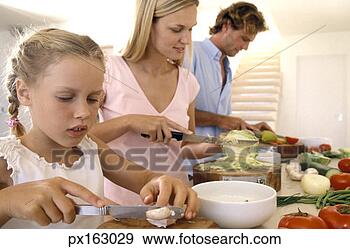 Stock Photograph - portrait of a 
family cooking 
in the kitchen. 
fotosearch - search 
stock photos, 
pictures, images, 
and photo clipart