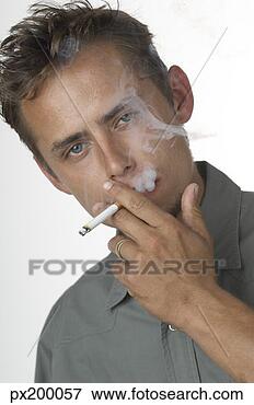 Picture - man smoking a 
cigarette. fotosearch 
- search stock 
photos, pictures, 
images, and photo 
clipart