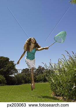 Stock Photo - girl with butterfly 
net. fotosearch 
- search stock 
photos, pictures, 
images, and photo 
clipart
