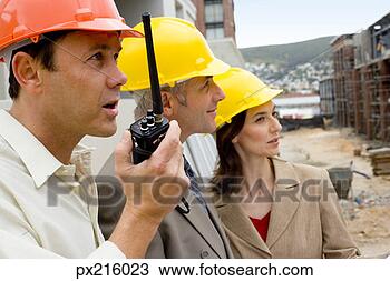 Stock Photo - foreman with architects 
at construction 
site. fotosearch 
- search stock 
photos, pictures, 
images, and photo 
clipart