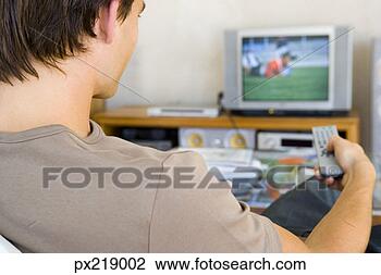 Banco de Imagem - homem,  observar, 
 televisão. fotosearch 
- busca de fotos, 
imagens e clipart