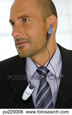 Stock Photo - businessman with 
ear piece. fotosearch 
- search stock 
photos, pictures, 
images, and photo 
clipart