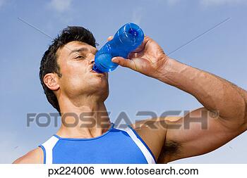 Stock Photo - man drinking from 
a water bottle. 
fotosearch - search 
stock photos, 
pictures, images, 
and photo clipart