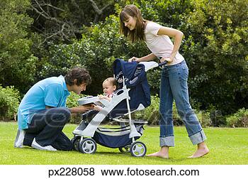 Stock Photo - family with a 
stroller. fotosearch 
- search stock 
photos, pictures, 
images, and photo 
clipart