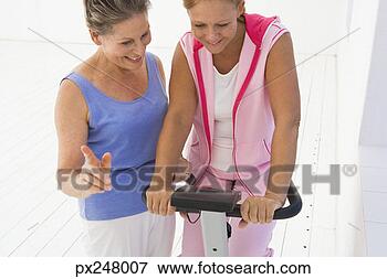 Picture - women with exercise 
equipment. fotosearch 
- search stock 
photos, pictures, 
images, and photo 
clipart