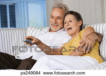 Stock Photo - couple watching 
television. fotosearch 
- search stock 
photos, pictures, 
images, and photo 
clipart