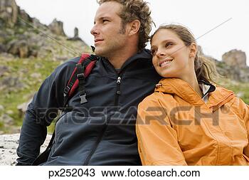 Stock Photo - couple relaxing 
together outdoors. 
fotosearch - search 
stock photos, 
pictures, images, 
and photo clipart