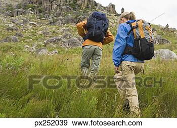 Stock Photograph - friends hiking 
outdoors. fotosearch 
- search stock 
photos, pictures, 
images, and photo 
clipart