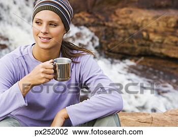 Stock Photo - woman relaxing 
outdoors. fotosearch 
- search stock 
photos, pictures, 
images, and photo 
clipart