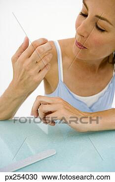 Stock Photography - woman with emery 
board. fotosearch 
- search stock 
photos, pictures, 
images, and photo 
clipart