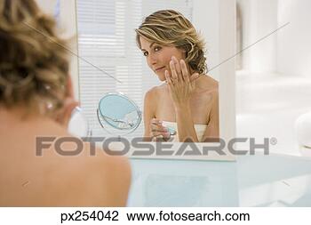Stock Photo - woman with mirror. 
fotosearch - search 
stock photos, 
pictures, images, 
and photo clipart