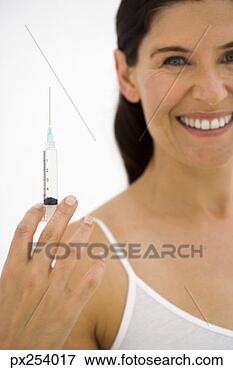 Picture - woman with syringe. 
fotosearch - search 
stock photos, 
pictures, images, 
and photo clipart