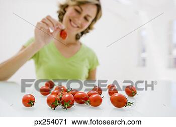 Stock Photography - woman with tomatoes. 
fotosearch - search 
stock photos, 
pictures, images, 
and photo clipart
