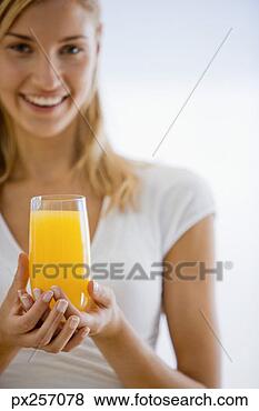 Stock Photo - woman with orange 
juice. fotosearch 
- search stock 
photos, pictures, 
images, and photo 
clipart