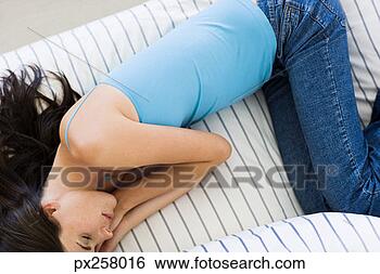 Stock Photo - woman lying down 
in fetal position. 
fotosearch - search 
stock photos, 
pictures, images, 
and photo clipart