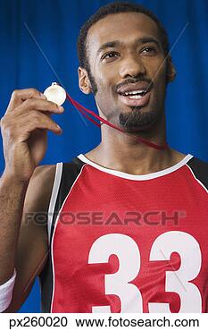 Stock Photography - basketball player 
with medal. fotosearch 
- search stock 
photos, pictures, 
images, and photo 
clipart