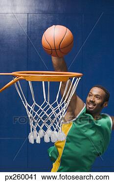 Arquivo de Fotografia - homem,  dunking, 
 basquetebol. 
fotosearch - busca 
de fotos, imagens 
e clipart