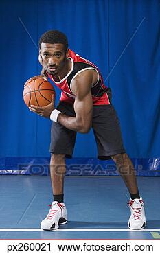 Stock Photography - man with basketball. 
fotosearch - search 
stock photos, 
pictures, images, 
and photo clipart