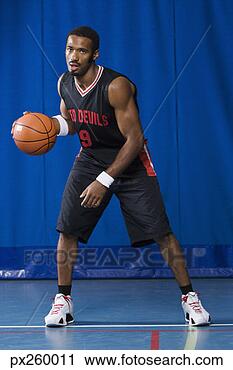 Stock Photography - man dribbling 
basketball. fotosearch 
- search stock 
photos, pictures, 
images, and photo 
clipart