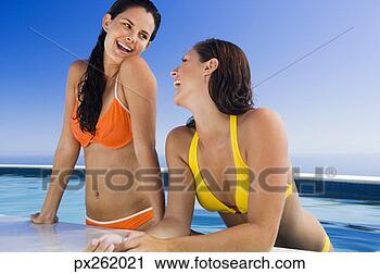 Stock Photography - women laughing 
in a pool. fotosearch 
- search stock 
photos, pictures, 
images, and photo 
clipart