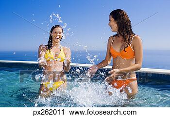 Stock Photography - women playing 
in a pool. fotosearch 
- search stock 
photos, pictures, 
images, and photo 
clipart