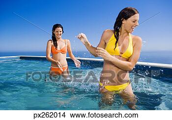 Stock Photo - women playing 
in a pool. fotosearch 
- search stock 
photos, pictures, 
images, and photo 
clipart