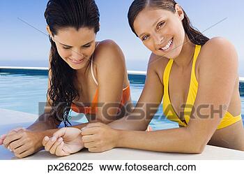 Stock Image - women standing 
in a pool. fotosearch 
- search stock 
photos, pictures, 
images, and photo 
clipart
