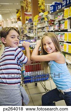 Stock Photo - siblings shopping 
at supermarket. 
fotosearch - search 
stock photos, 
pictures, images, 
and photo clipart