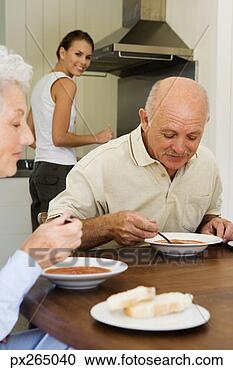 Stock Photography - couple chatting 
over a meal. fotosearch 
- search stock 
photos, pictures, 
images, and photo 
clipart