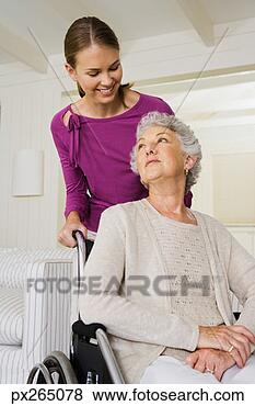 Stock Photo - smiling woman 
pushing older 
woman in wheelchair. 
fotosearch - search 
stock photos, 
pictures, images, 
and photo clipart