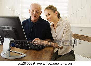 Stock Photograph - woman helping 
man with computer. 
fotosearch - search 
stock photos, 
pictures, images, 
and photo clipart