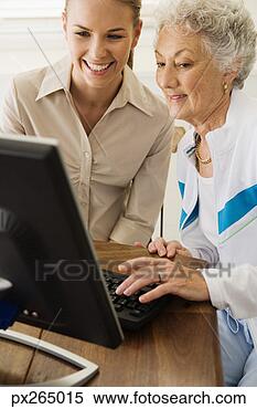 Stock Image - women using computer. 
fotosearch - search 
stock photos, 
pictures, images, 
and photo clipart