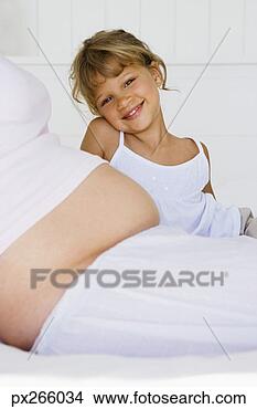 Stock Photo - girl with pregnant 
mother. fotosearch 
- search stock 
photos, pictures, 
images, and photo 
clipart