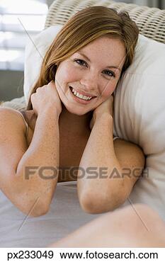 Stock Photograph - smiling woman 
in chair. fotosearch 
- search stock 
photos, pictures, 
images, and photo 
clipart