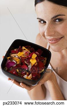 Stock Photo - woman with bowl 
of flower petals. 
fotosearch - search 
stock photos, 
pictures, images, 
and photo clipart