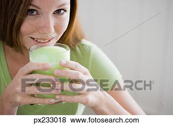 Stock Photo - woman with glass 
of juice. fotosearch 
- search stock 
photos, pictures, 
images, and photo 
clipart