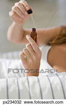 Stock Photo - woman with medicine. 
fotosearch - search 
stock photos, 
pictures, images, 
and photo clipart