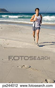 Stock Photo - man running on 
beach. fotosearch 
- search stock 
photos, pictures, 
images, and photo 
clipart