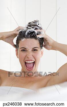 Stock Photo - happy woman washing 
her hair. fotosearch 
- search stock 
photos, pictures, 
images, and photo 
clipart