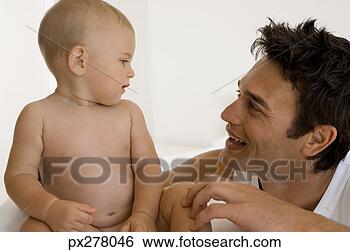Banco de Imagem - pai,  bebê,  rosto, 
 rosto. fotosearch 
- busca de fotos, 
imagens e clipart