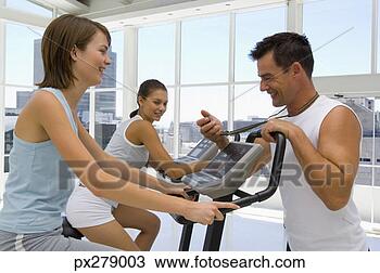 Stock Photo - trainer timing 
woman in exercise 
class. fotosearch 
- search stock 
photos, pictures, 
images, and photo 
clipart