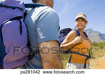 Stock Photo - woman and man 
with backpacks. 
fotosearch - search 
stock photos, 
pictures, images, 
and photo clipart
