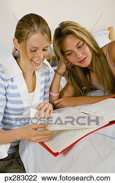Stock Photo - friends doing 
homework together. 
fotosearch - search 
stock photos, 
pictures, images, 
and photo clipart