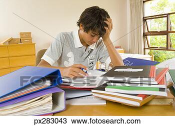 Stock Photo - frustrated teenage 
boy doing homework. 
fotosearch - search 
stock photos, 
pictures, images, 
and photo clipart
