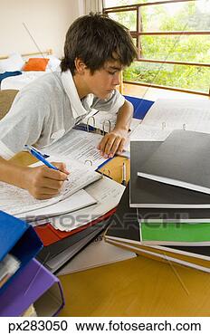 Stock Photography - teenage boy doing 
homework. fotosearch 
- search stock 
photos, pictures, 
images, and photo 
clipart