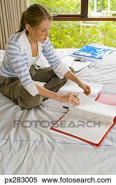 Stock Image - teenage girl doing 
homework. fotosearch 
- search stock 
photos, pictures, 
images, and photo 
clipart