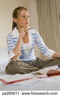 Stock Photography - teenage girl doing 
homework. fotosearch 
- search stock 
photos, pictures, 
images, and photo 
clipart