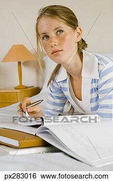 Stock Photo - teenage girl doing 
homework. fotosearch 
- search stock 
photos, pictures, 
images, and photo 
clipart